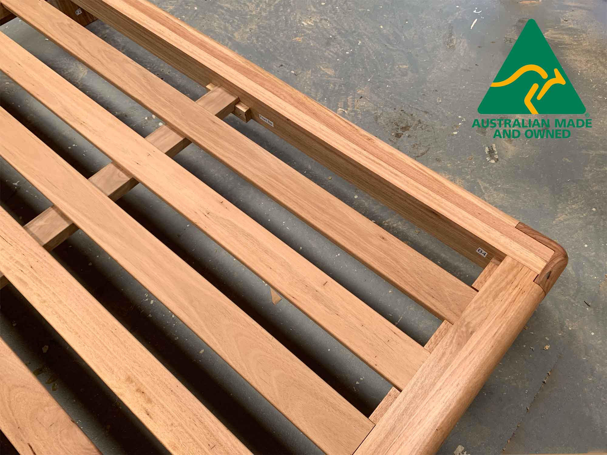 Long one-piece solid hardwood bed slats providing strong and stable support