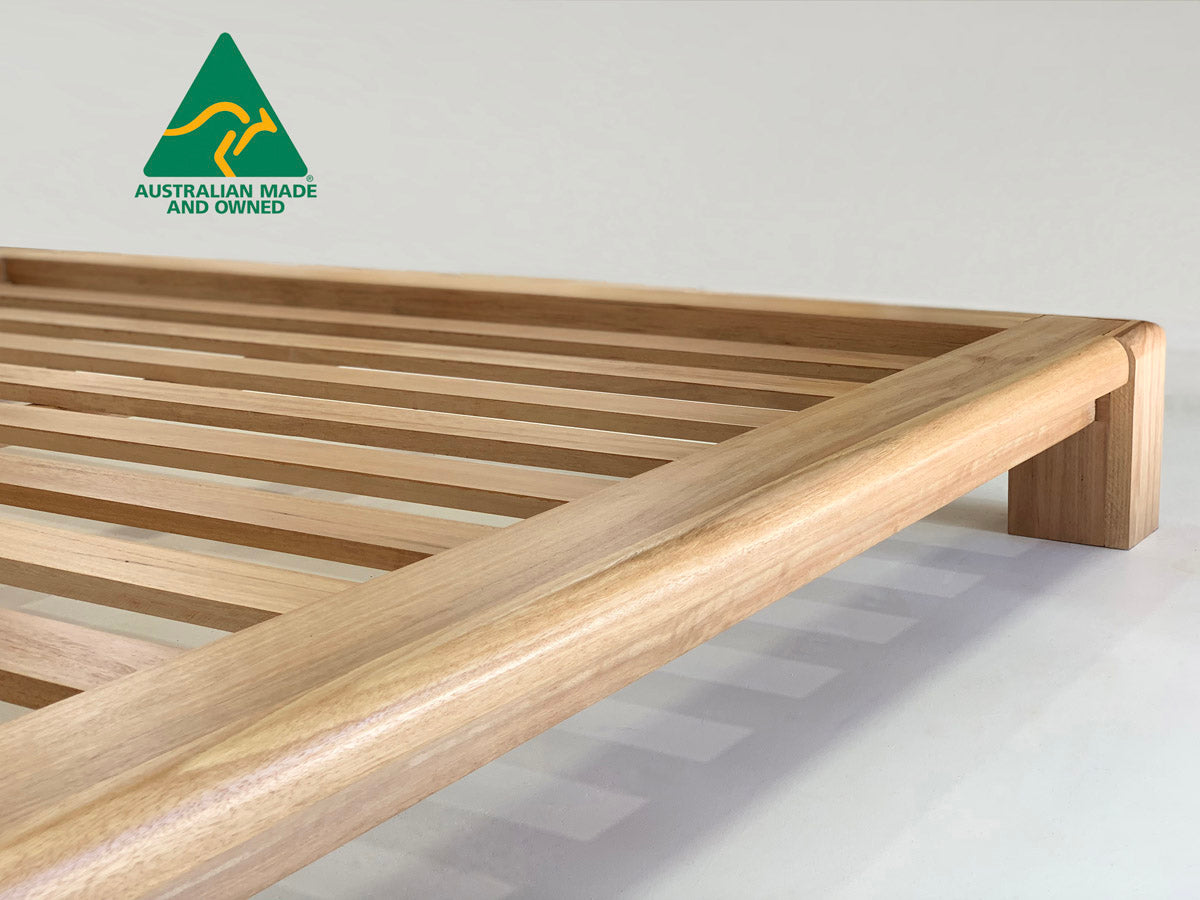 Chunk hardwood bed frame with thick timber legs and sturdy base