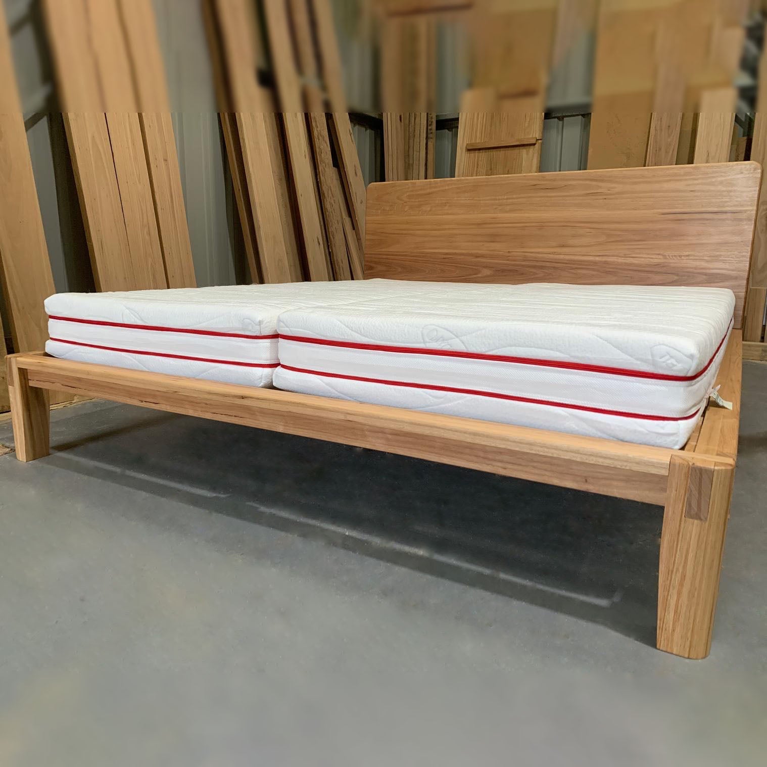 Hardwood bed frame with natural latex mattress bundle set styled in bedroom