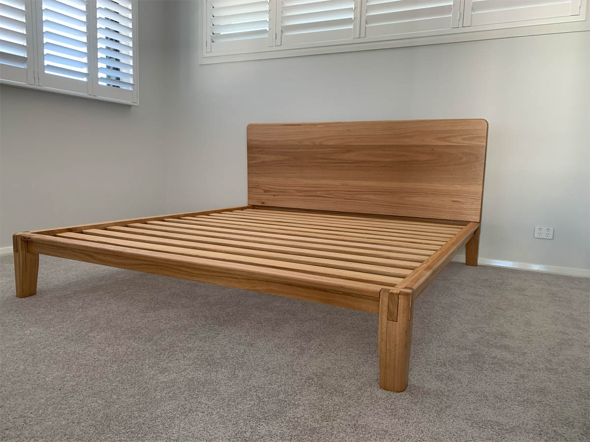 Solid wood Castle Joint bed frame styled in modern bedroom interior