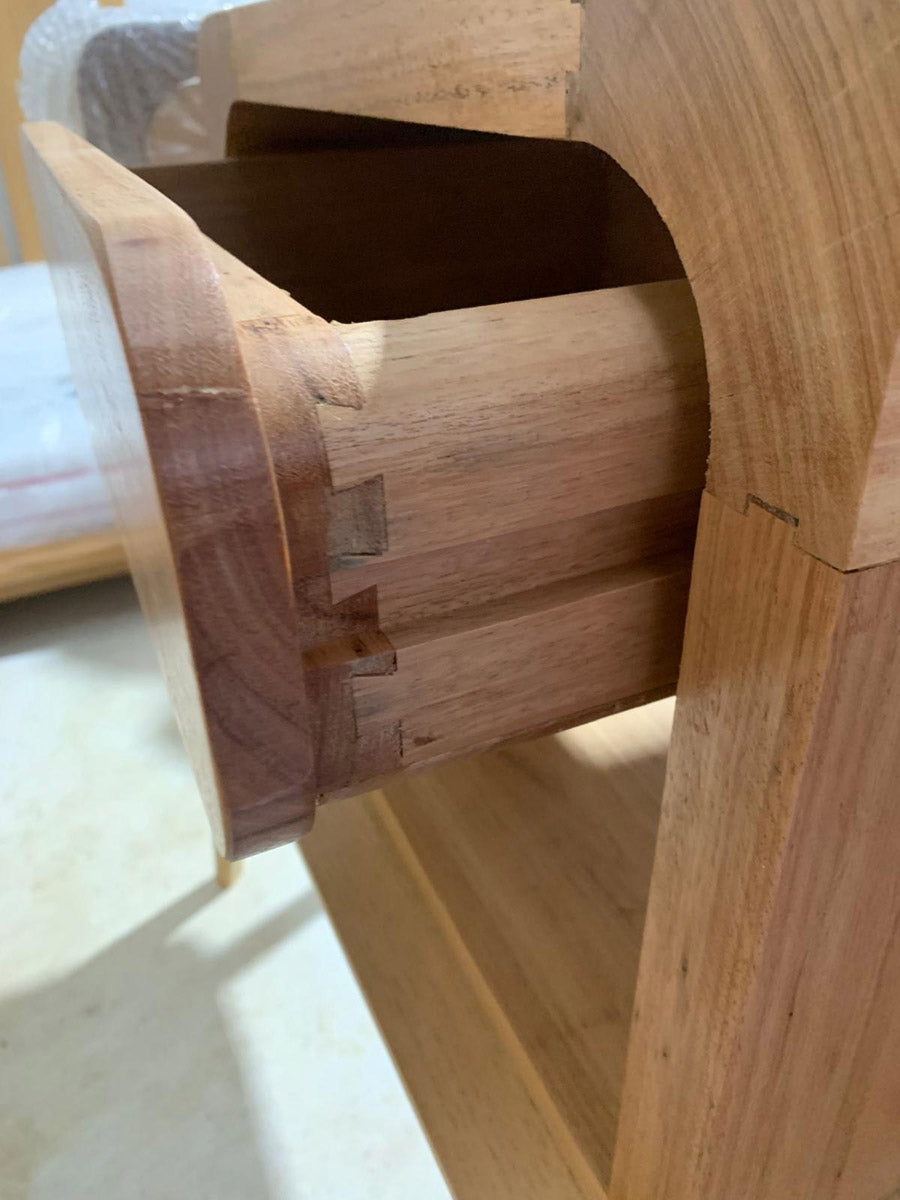 Minimalist solid hardwood bedside table with natural timber grain
